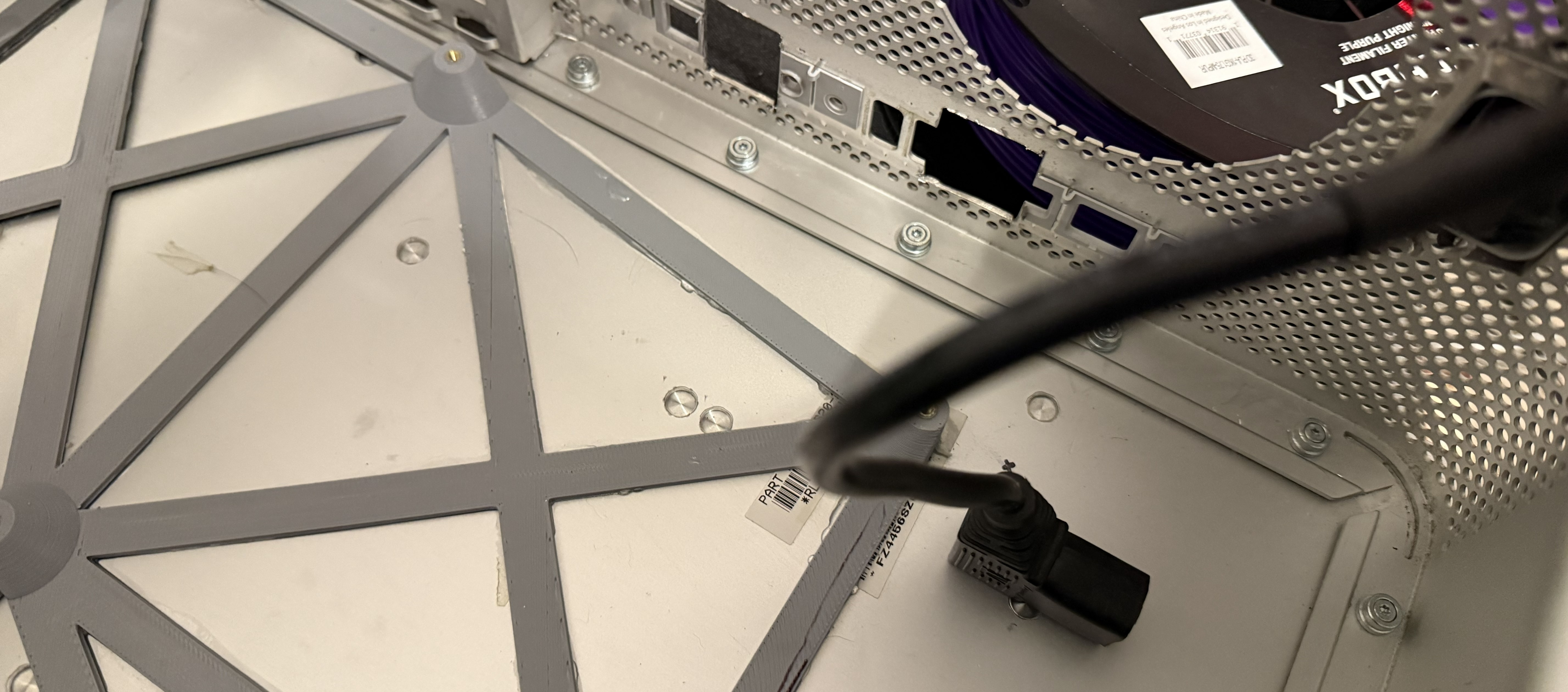 A short power lead inside the case with a right-angle connector on the end