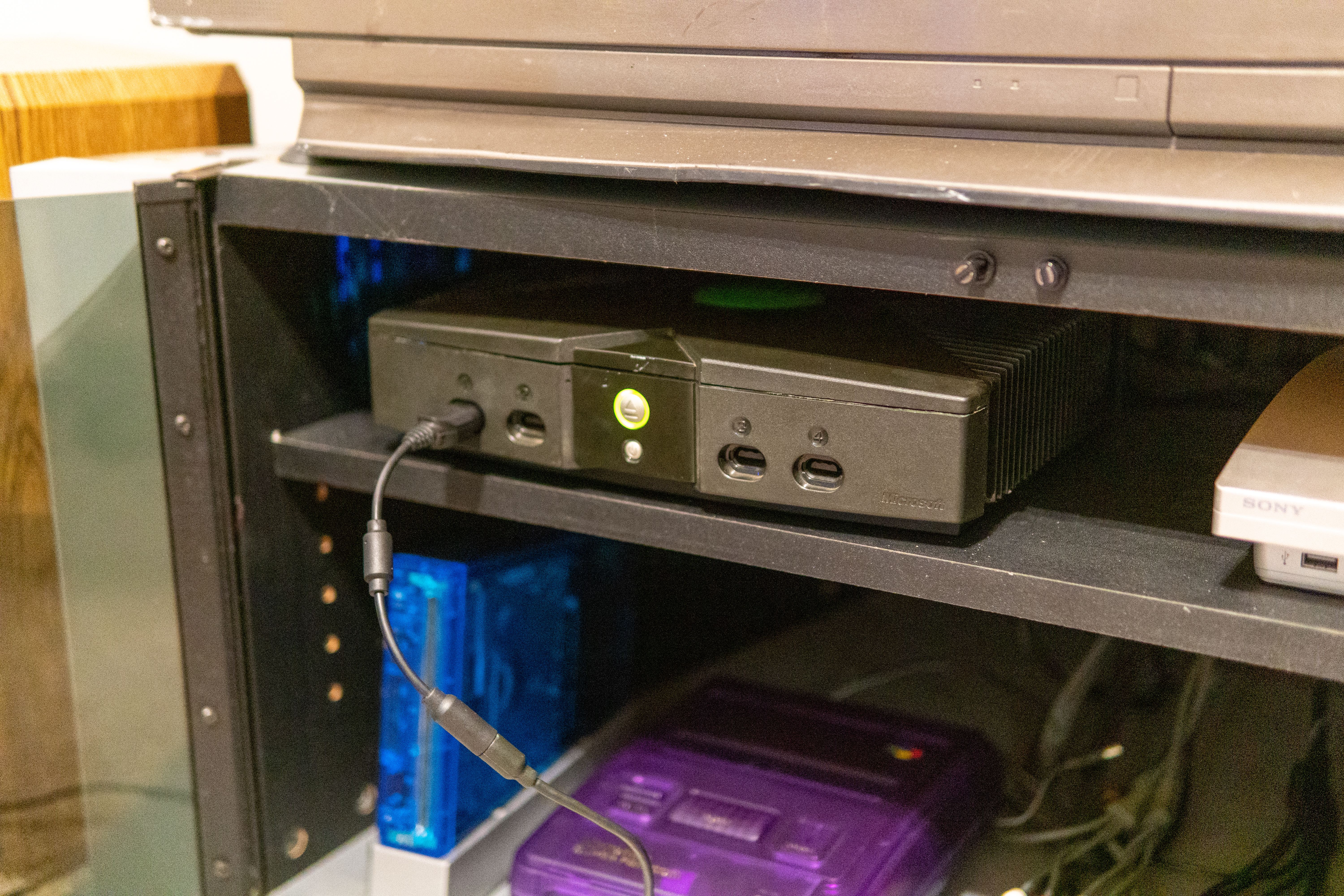 Xbox in cabinet.